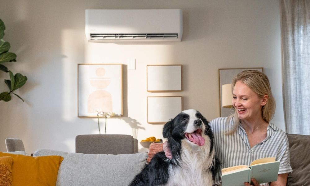 Woman reading a book indoors with air conditioning