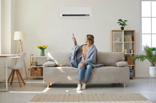 A woman is cooling in the room with her mini split