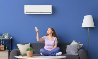 Woman turning on the air conditioner
