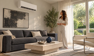 Woman checking wall mounted air conditioner