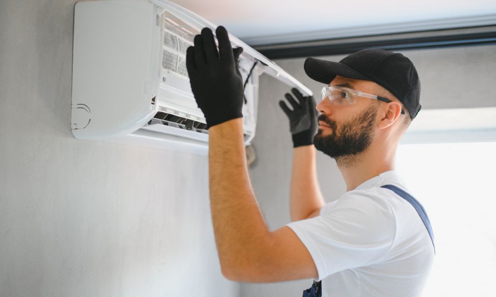 Man installing a Mini Split AC